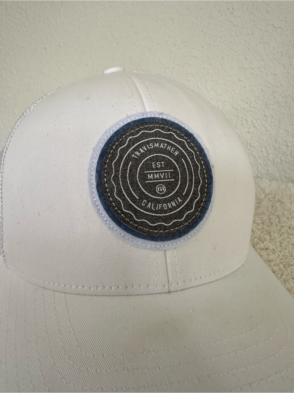 Travis Mathew White Cap with Dark Gray Patch